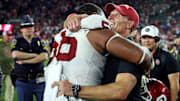 Oklahoma Sooners head coach Brent Venables celebrates with defensive lineman Gracen Halton