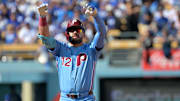 Oct 9, 2025; Los Angeles, California, USA; Philadelphia Phillies left fielder Kyle Schwarber (12) reacts after a double in the first inning against the Los Angeles Dodgers during game four of the NLDS round for the 2025 MLB playoffs at Dodger Stadium. Mandatory Credit: Jayne Kamin-Oncea-Imagn Images