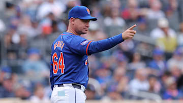 May 14, 2024; New York City, New York, USA; New York Mets manager Carlos Mendoza (64) makes a pitching change during the seventh inning against the Philadelphia Phillies at Citi Field. Mandatory Credit: Brad Penner-Imagn Images