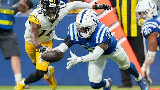Indianapolis Colts safety Julian Blackmon (32) recovers a ball fumbled by Pittsburgh Steelers wide receiver George Pickens (14) on Sunday, Sept. 29, 2024, during a game against the Pittsburgh Steelers at Lucas Oil Stadium in Indianapolis.