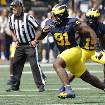 Sep 14, 2024; Ann Arbor, Michigan, USA;  Michigan Wolverines defensive end Cameron Brandt (91) rushes on defense against the Arkansas State Red Wolves at Michigan Stadium.