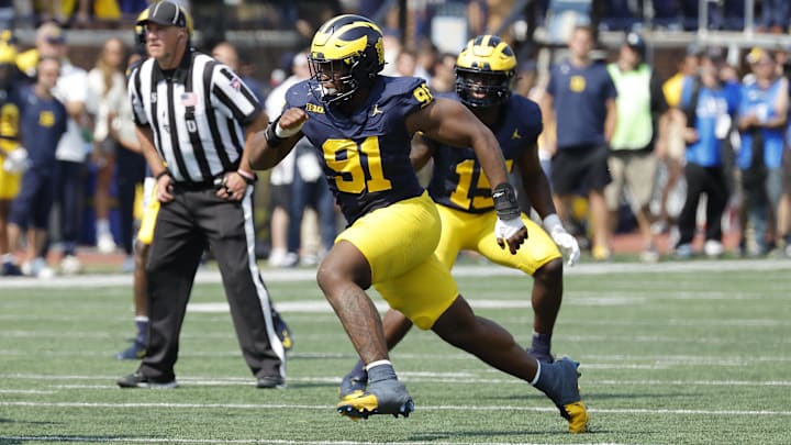 Sep 14, 2024; Ann Arbor, Michigan, USA;  Michigan Wolverines defensive end Cameron Brandt (91) rushes on defense against the Arkansas State Red Wolves at Michigan Stadium.