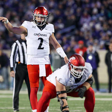 Nov 23, 2024; Manhattan, Kansas, USA; Cincinnati Bearcats quarterback Brendan Sorsby (2) calls a play at the line of scrimmage against the Kansas State Wildcats at Bill Snyder Family Football Stadium. Mandatory Credit: Scott Sewell-Imagn Images
