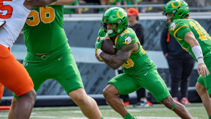 Oregon running back Makhi Hughes carries the ball as the Oregon Ducks host the Oklahoma State Cowboys on Sept. 6, 2025, at Autzen Stadium in Eugene, Oregon.