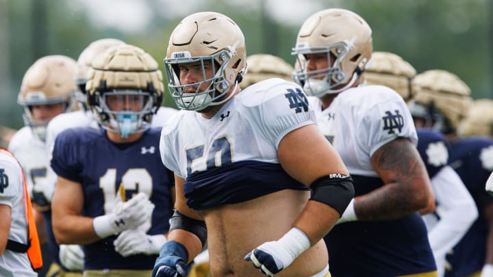 Notre Dame offensive lineman Rocco Spindler (50) runs to a drill during a Notre Dame football practice at Irish Athletic Center on Tuesday, Aug. 6, 2024, in South Bend.