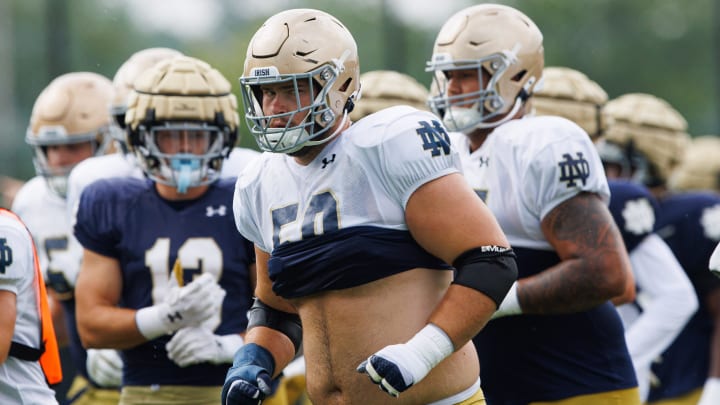 Notre Dame offensive lineman Rocco Spindler (50) runs to a drill during a Notre Dame football practice at Irish Athletic Center on Tuesday, Aug. 6, 2024, in South Bend.