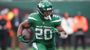 Dec 24, 2023; East Rutherford, New Jersey, USA; New York Jets running back Breece Hall (20) carries the ball during the first half against the Washington Commanders at MetLife Stadium.