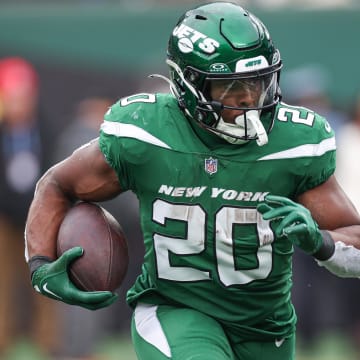 Dec 24, 2023; East Rutherford, New Jersey, USA; New York Jets running back Breece Hall (20) carries the ball during the first half against the Washington Commanders at MetLife Stadium.