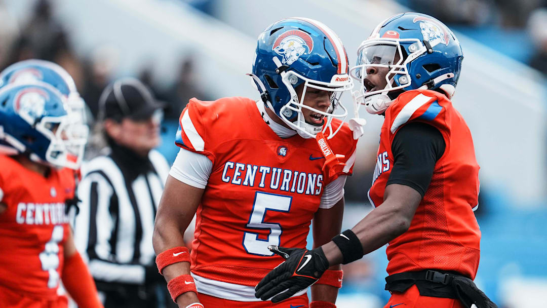 Christian Academy of Louisville's Stone Perkins (5) celebrates his touchdown with Christian Academy of Louisville's JaHyde Brown (1) in the first half at the KHSAA class 3A football state final at Kroger Field in Lexington Saturday, December 6, 2025.