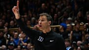 Dec 2, 2025; Durham, North Carolina, USA; Duke Blue Devils head coach Jon Scheyer directs his team during the first half against the Florida Gators at Cameron Indoor Stadium. Mandatory Credit: Rob Kinnan-Imagn Images