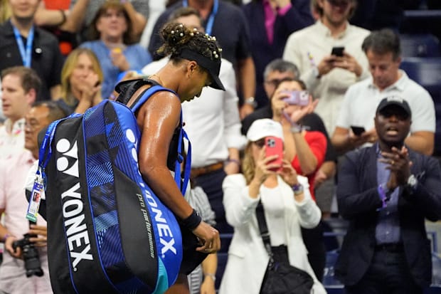 Fans cheer for Naomi Osaka after her match at the US Open.