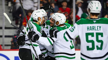 Mar 27, 2025; Calgary, Alberta, CAN; Dallas Stars right wing Mikko Rantanen (96) celebrates his goal with teammates against the Calgary Flames during the third period at Scotiabank Saddledome. Mandatory Credit: Sergei Belski-Imagn Images