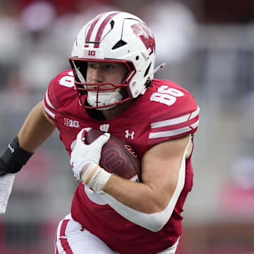 Sep 6, 2025; Madison, Wisconsin, USA; Wisconsin Badgers tight end Lance Mason (86) runs the ball against the Middle Tennessee Blue Raiders during the second half at Camp Randall Stadium. Mandatory Credit: Kayla Wolf-Imagn Images