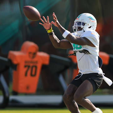 Miami Dolphins wide receiver Tyreek Hill (10) catches the football during training camp at Baptist Health Training Complex.