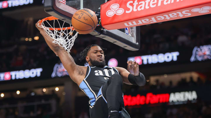 Mar 25, 2024; Atlanta, Georgia, USA; Atlanta Hawks forward Bruno Fernando (24) dunks against the Boston Celtics in the second half at State Farm Arena. Mandatory Credit: Brett Davis-USA TODAY Sports