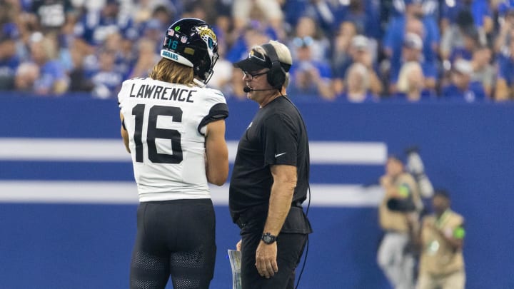 Sep 10, 2023; Indianapolis, Indiana, USA; Jacksonville Jaguars quarterback Trevor Lawrence (16) and head coach Doug Pederson talk during a timeout  in the second quarter against the Indianapolis Colts at Lucas Oil Stadium. Mandatory Credit: Trevor Ruszkowski-USA TODAY Sports