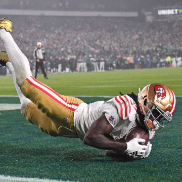 Dec 3, 2023; Philadelphia, Pennsylvania, USA; San Francisco 49ers wide receiver Brandon Aiyuk (11) catches touchdown pass against Philadelphia Eagles safety Reed Blankenship (32) during the second quarter at Lincoln Financial Field. Mandatory Credit: Eric Hartline-USA TODAY Sports