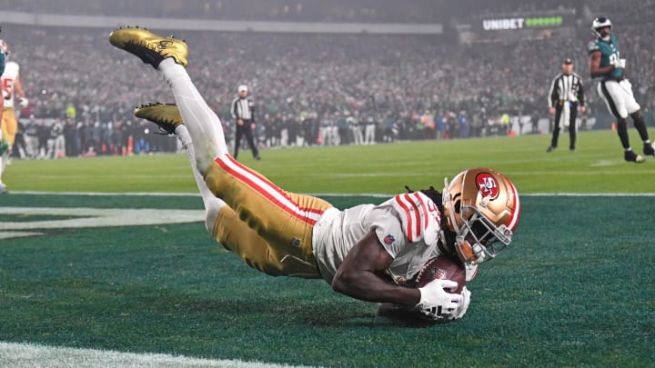 Dec 3, 2023; Philadelphia, Pennsylvania, USA; San Francisco 49ers wide receiver Brandon Aiyuk (11) catches touchdown pass against Philadelphia Eagles safety Reed Blankenship (32) during the second quarter at Lincoln Financial Field. Mandatory Credit: Eric Hartline-USA TODAY Sports