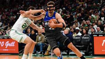 Nov 23, 2025; Boston, Massachusetts, USA; Boston Celtics guard Hugo Gonzalez (28) defends Orlando Magic forward Franz Wagner (22) during the first half at TD Garden. Mandatory Credit: Bob DeChiara-Imagn Images