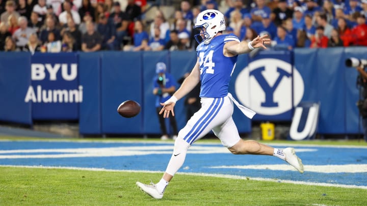 Oct 21, 2023; Provo, Utah, USA; Brigham Young Cougars punter Ryan Rehkow (24) punts the ball against the Texas Tech Red Raiders in the first half at LaVell Edwards Stadium.