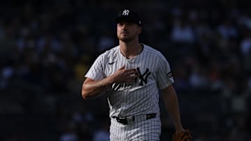 Apr 27, 2025; Bronx, New York, USA; New York Yankees starting pitcher Clarke Schmidt (36) walks off the fields after the top of the first inning against the Toronto Blue Jays at Yankee Stadium. Mandatory Credit: Vincent Carchietta-Imagn Images