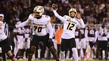 Nov 23, 2024; Starkville, Mississippi, USA; Missouri Tigers quarterback Brady Cook (12) throws against the Mississippi State Bulldogs during the third quarter at Davis Wade Stadium at Scott Field. Mandatory Credit: Matt Bush-Imagn Images