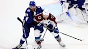 Jun 26, 2022; Tampa, Florida, USA; Tampa Bay Lightning defenseman Erik Cernak (81) and Colorado Avalanche left wing Gabriel Landeskog (92) attempt to get the puck during the first period in game six of the 2022 Stanley Cup Final at Amalie Arena. Mandatory Credit: Mark J. Rebilas-Imagn Images