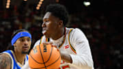 Jan 10, 2025; College Park, Maryland, USA; Maryland Terrapins center Derik Queen (25) drives to the basket against UCLA Bruins guard Skyy Clark (55) during the second half at Xfinity Center. Mandatory Credit: Reggie Hildred-Imagn Images