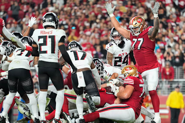 San Francisco 49ers offensive tackle Dominick Puni celebrates