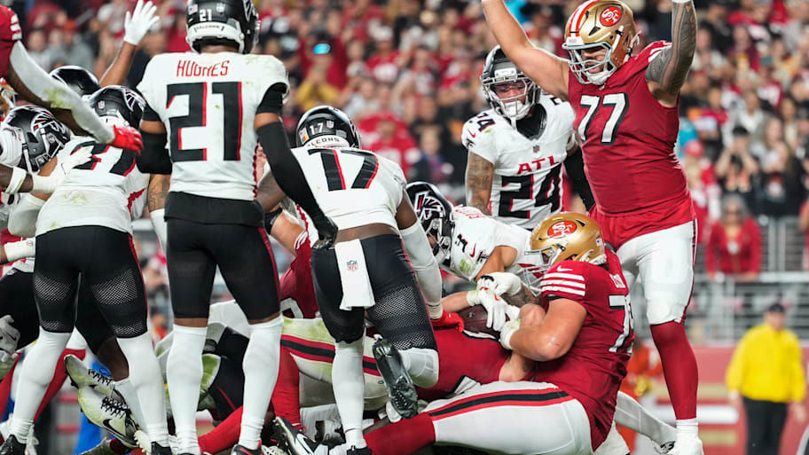 San Francisco 49ers offensive tackle Dominick Puni celebrates