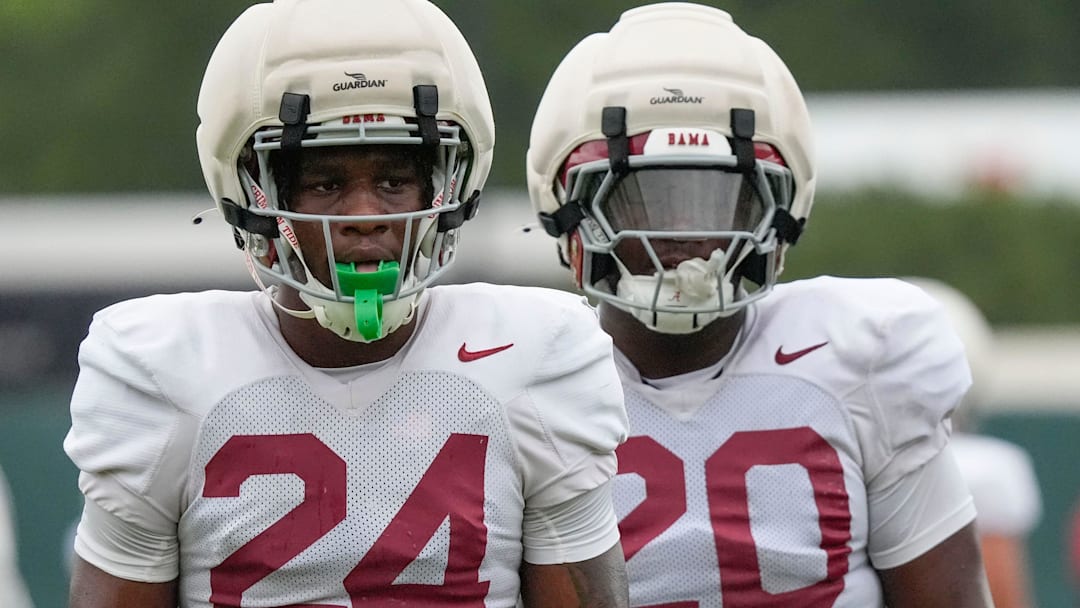 Aug. 3, 2025; Tuscaloosa, AL, USA; Linebackers Noah Carter (24) and Jah-Marien Latham (20) ready themselves for a drill during practice Sunday at the University of Alabama.
