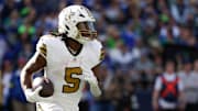 New Orleans Saints running back Kendre Miller (5) runs the ball during the third quarter against the Seattle Seahawks at Lumen Field. 