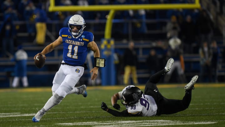 SDSU's quarterback Mark Gronowski (11) runs with the ball on Friday, Dec. 15, 2023 at Dana J. Dykhouse in Brookings.