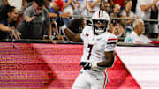 Aug 31, 2024; Tucson, Arizona, USA; Arizona Wildcats running back Quali Conley (7) celebrates touchdown with Arizona Wildcat fans during fourth quarter at Arizona Stadium. 