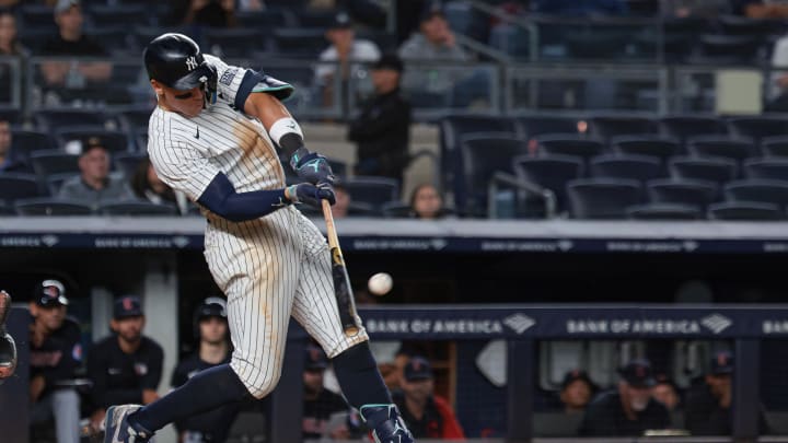 Aug 20, 2024; Bronx, New York, USA; New York Yankees center fielder Aaron Judge (99) hits a two run double during the twelfth inning against the Cleveland Guardians at Yankee Stadium. Mandatory Credit: Vincent Carchietta-USA TODAY Sports