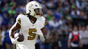 Sep 21, 2025; Seattle, Washington, USA; New Orleans Saints running back Kendre Miller (5) runs the ball during the third quarter against the Seattle Seahawks at Lumen Field. Mandatory Credit: Joe Nicholson-Imagn Images