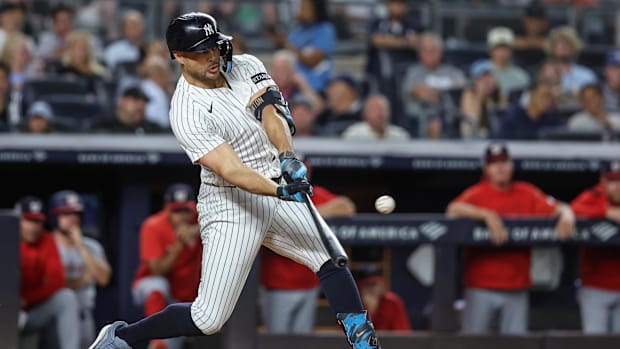 New York Yankees right fielder Giancarlo Stanton (27) hits a two run home run