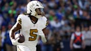 Sep 21, 2025; Seattle, Washington, USA; New Orleans Saints running back Kendre Miller (5) runs the ball during the third quarter against the Seattle Seahawks at Lumen Field. Mandatory Credit: Joe Nicholson-Imagn Images
