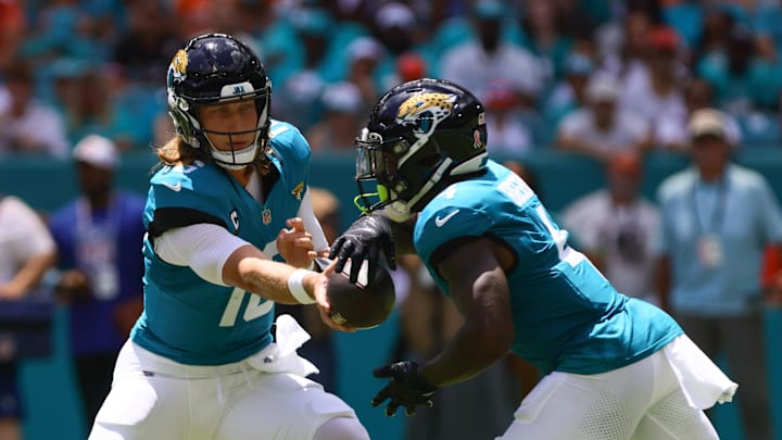 Sep 8, 2024; Miami Gardens, Florida, USA; Jacksonville Jaguars quarterback Trevor Lawrence (16) fakes a handoff to running back Tank Bigsby (4) during the first quarter at Hard Rock Stadium. Mandatory Credit: Sam Navarro-Imagn Images