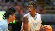 Oct 4, 2025; Charlotte, NC, USA; North Carolina Tar Heels forward Caleb Wilson (8) with the ball as forward Jarin Stevenson (15) defends in the first half at Dean E. Smith Center. Mandatory Credit: Bob Donnan-Imagn Images
