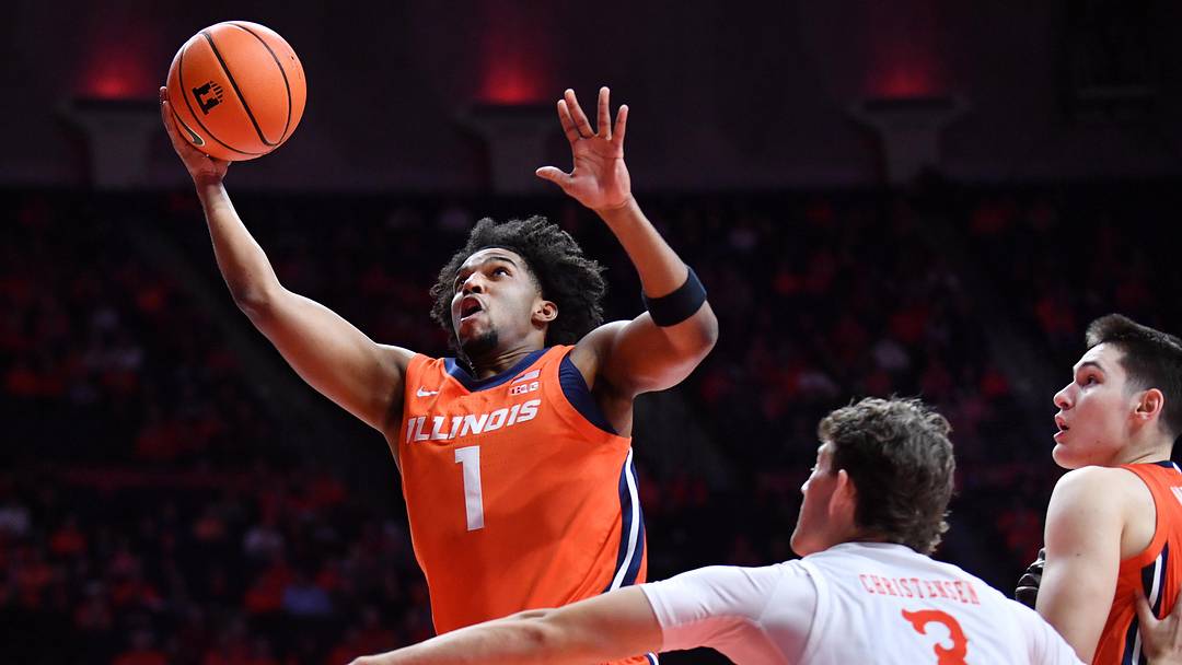 Nov 24, 2025; Champaign, Illinois, USA;  Illinois Fighting Illini guard Brandon Lee (1) drives to the b basket as U3 defends during the first half at State Farm Center. Mandatory Credit: Ron Johnson-Imagn Images