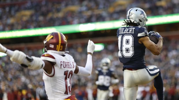 Dallas Cowboys wide receiver Jalen Tolbert (18) catches a touchdown pass as Washington Commanders cornerback Emmanuel Forbes