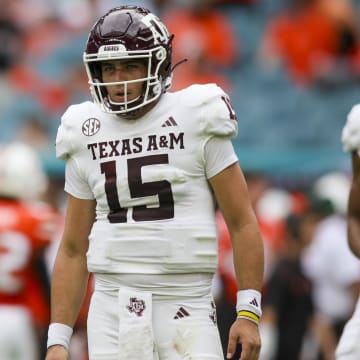 Sep 9, 2023; Miami Gardens, Florida, USA; Texas A&M Aggies quarterback Conner Weigman (15) looks on against the Miami Hurricanes during the first quarter at Hard Rock Stadium.