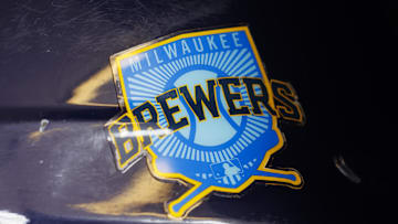 Jun 18, 2023; Milwaukee, Wisconsin, USA;  A Milwaukee Brewers logo on a batting helmet in the dugout prior to the game against the Pittsburgh Pirates at American Family Field. Mandatory Credit: Jeff Hanisch-Imagn Images