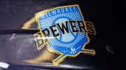 Jun 18, 2023; Milwaukee, Wisconsin, USA;  A Milwaukee Brewers logo on a batting helmet in the dugout prior to the game against the Pittsburgh Pirates at American Family Field. Mandatory Credit: Jeff Hanisch-Imagn Images
