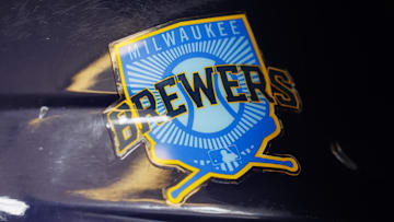 Jun 18, 2023; Milwaukee, Wisconsin, USA;  A Milwaukee Brewers logo on a batting helmet in the dugout prior to the game against the Pittsburgh Pirates at American Family Field. Mandatory Credit: Jeff Hanisch-Imagn Images