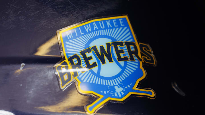 Jun 18, 2023; Milwaukee, Wisconsin, USA;  A Milwaukee Brewers logo on a batting helmet in the dugout prior to the game against the Pittsburgh Pirates at American Family Field. Mandatory Credit: Jeff Hanisch-Imagn Images