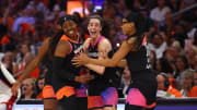 Jul 20, 2024; Phoenix, AZ, USA; Team WNBA player Arike Ogunbowale celebrates with Caitlin Clark and Allisha Gray after making a three point shot during the second half against the USA Women's National Team at Footprint Center. 