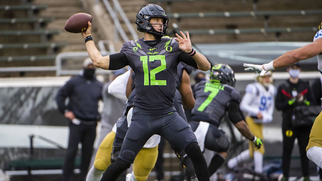 Nov 21, 2020; Eugene, Oregon, USA; Oregon Ducks quarterback Tyler Shough (12) throws a pass during the second half against the UCLA Bruins at Autzen Stadium. Nov 21, 2020; Eugene, Oregon, USA; Oregon Ducks quarterback Tyler Shough (12) throws a pass during the second half against the UCLA Bruins at Autzen Stadium.