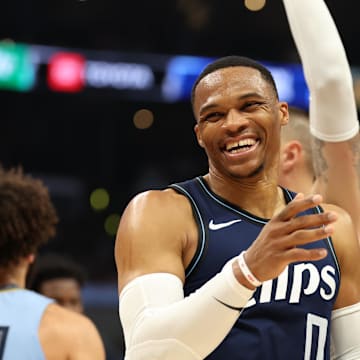 Dec 29, 2023; Los Angeles, California, USA;  Los Angeles Clippers guard Russell Westbrook (0) smiles after forward Paul George (13) makes a three point basket during the third quarter against the Memphis Grizzlies at Crypto.com Arena. Mandatory Credit: Kiyoshi Mio-Imagn Images